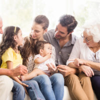 Happy extended family smiling at home Happy extended family smiling at home